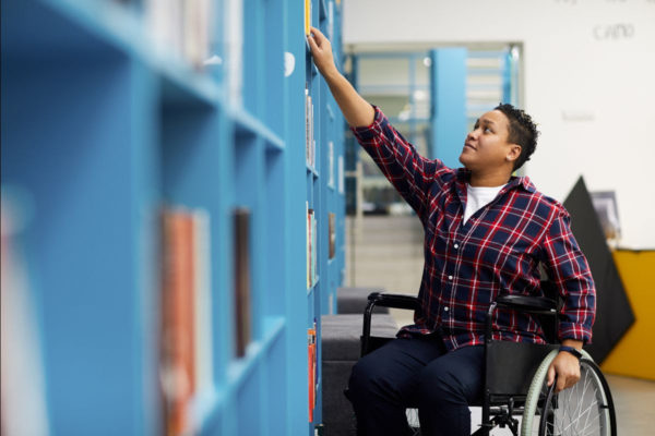 main in wheelchair at library photo