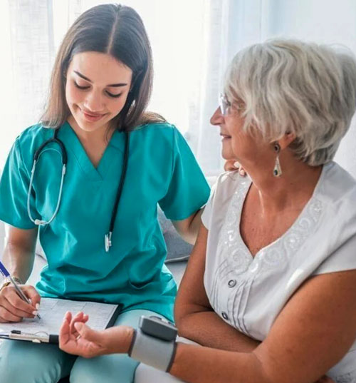 young-nurse-with-elderly photo